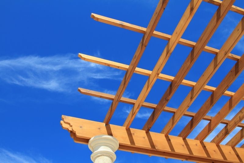 Open-roof pergola against a bright blue sky