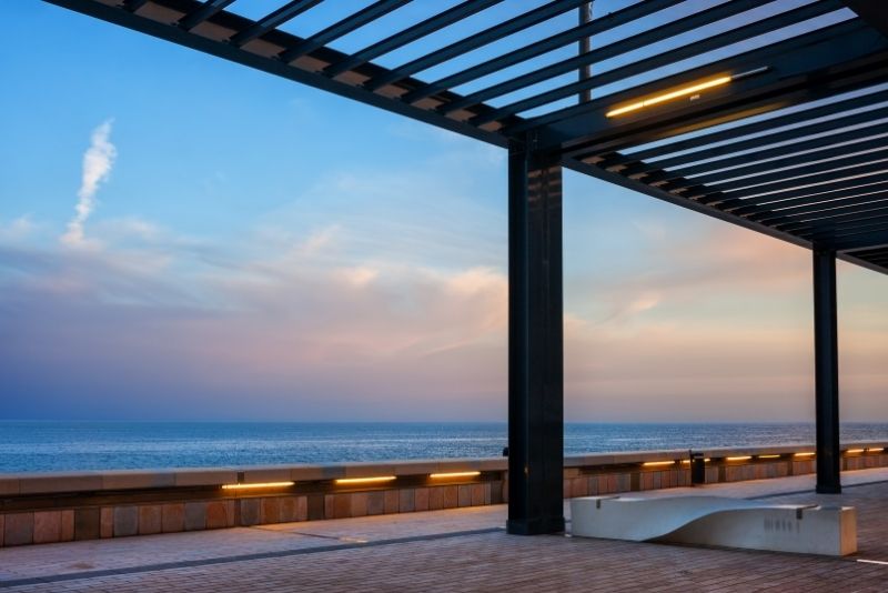 Pergola creating a shaded walkway near the beach