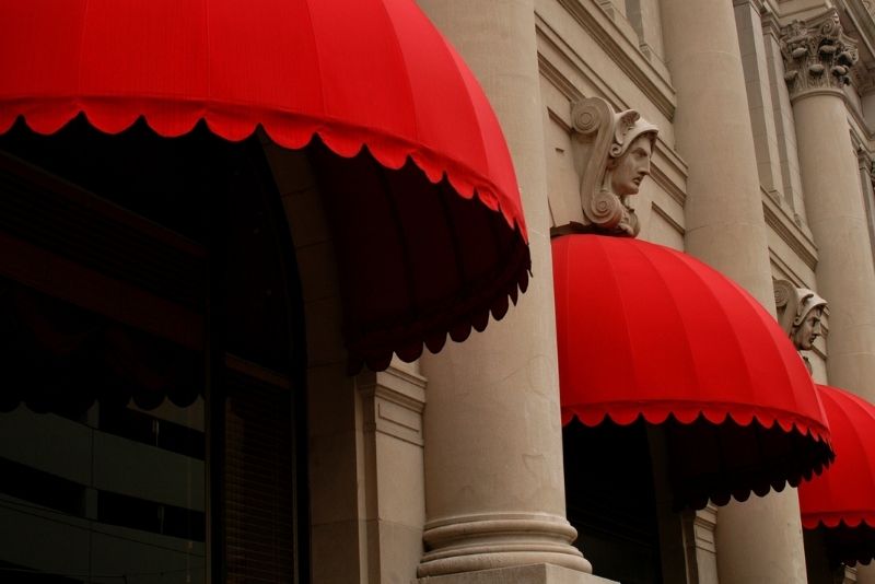 Red, decorated awnings on windows