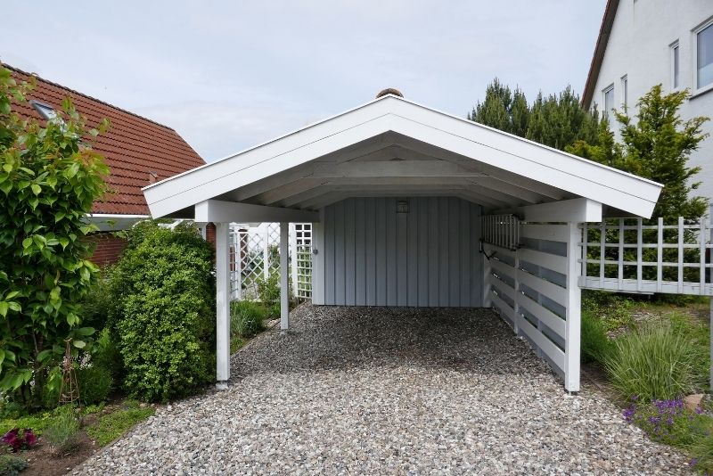 A timber white carport for a home