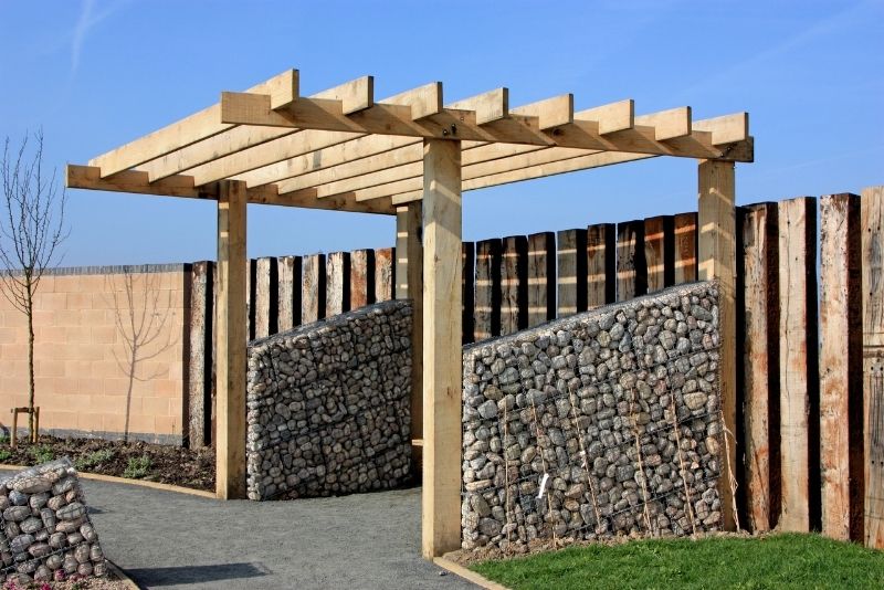 A wooden pergola at an entrance